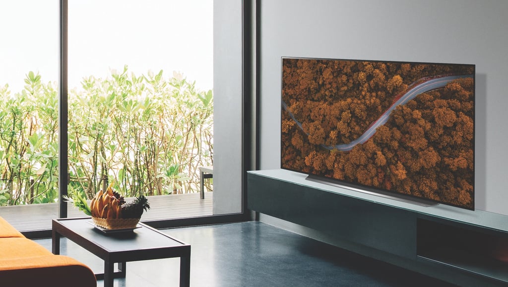 A flat screen tv sitting on top of a table