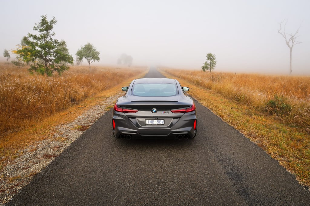 A car driving down a country road