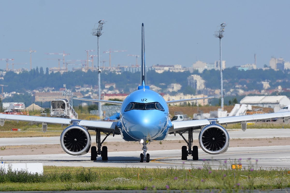 A large passenger jet sitting on top of a runway