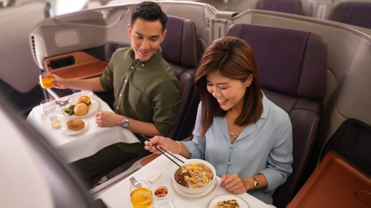 A group of people sitting at a table eating food