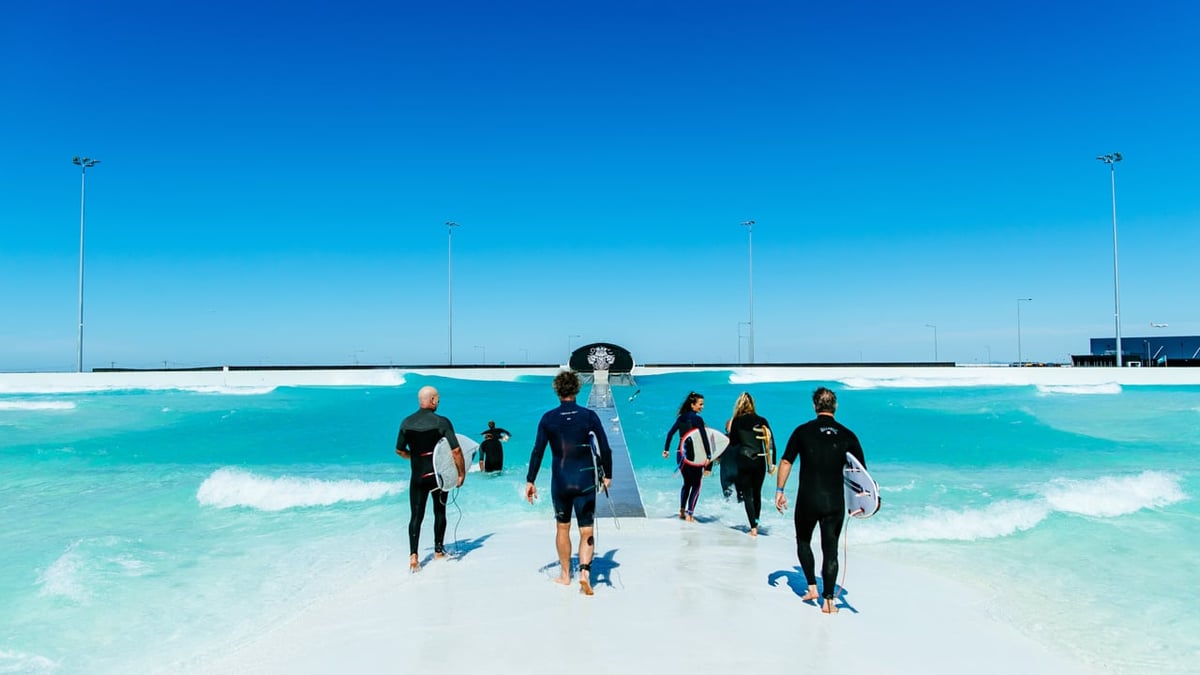 A group of people skiing on the water