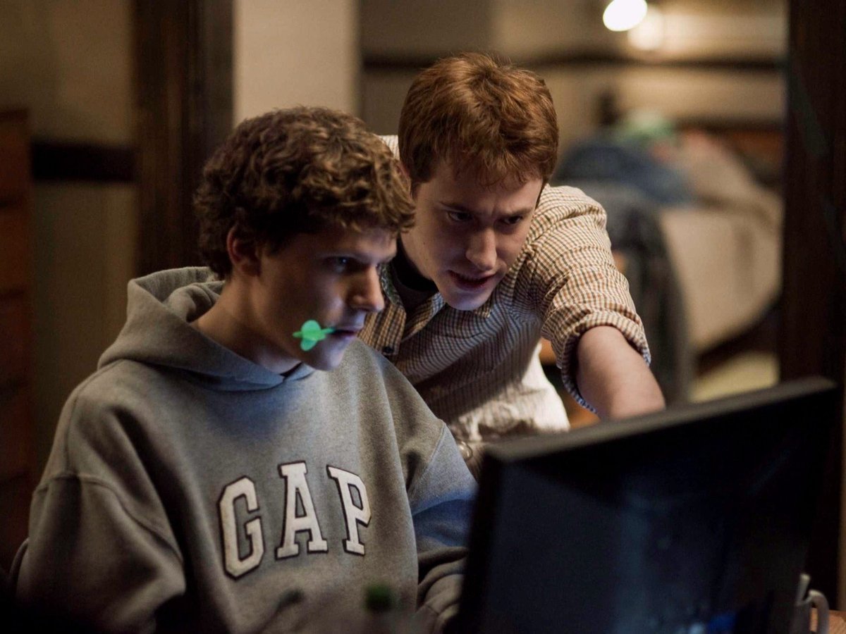 A young boy using a laptop computer