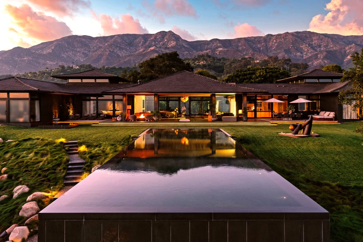 A house with a mountain in the background