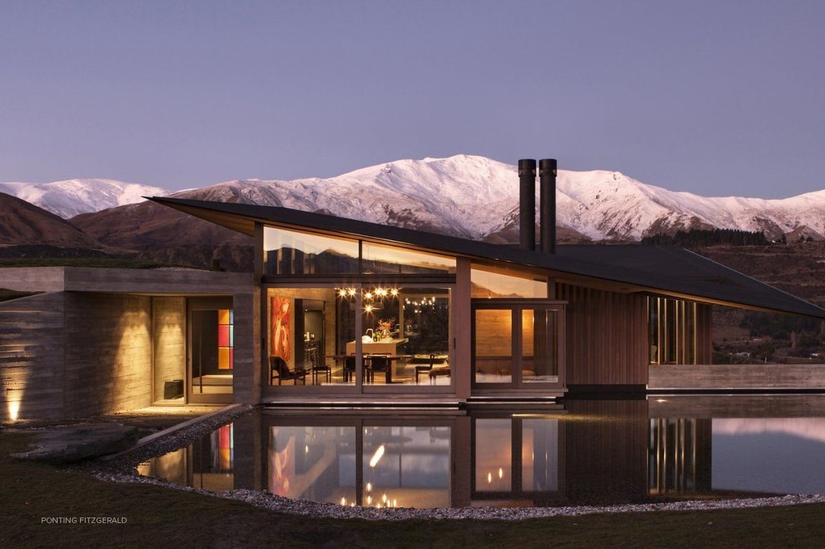 A building with a mountain in the snow