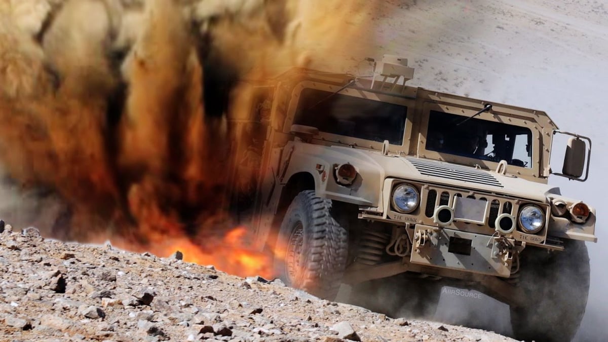 A truck driving down a dirt road