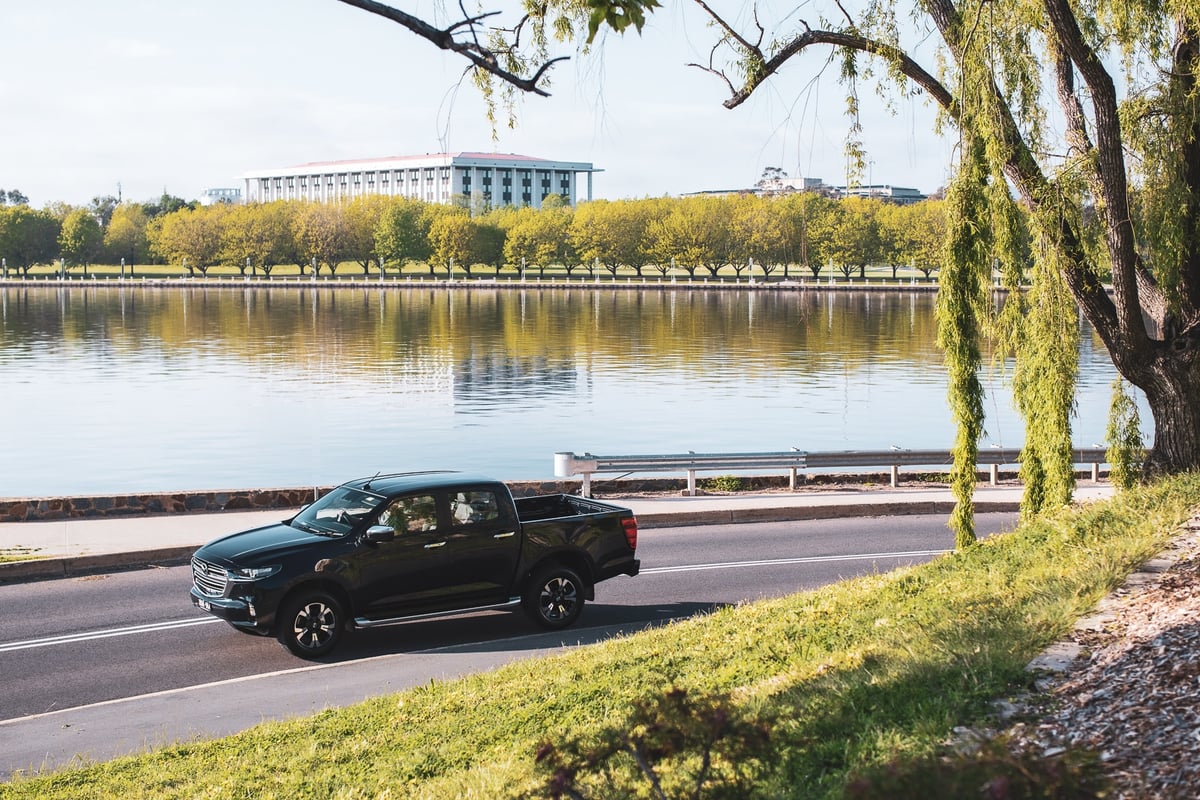 A car parked on the side of a river