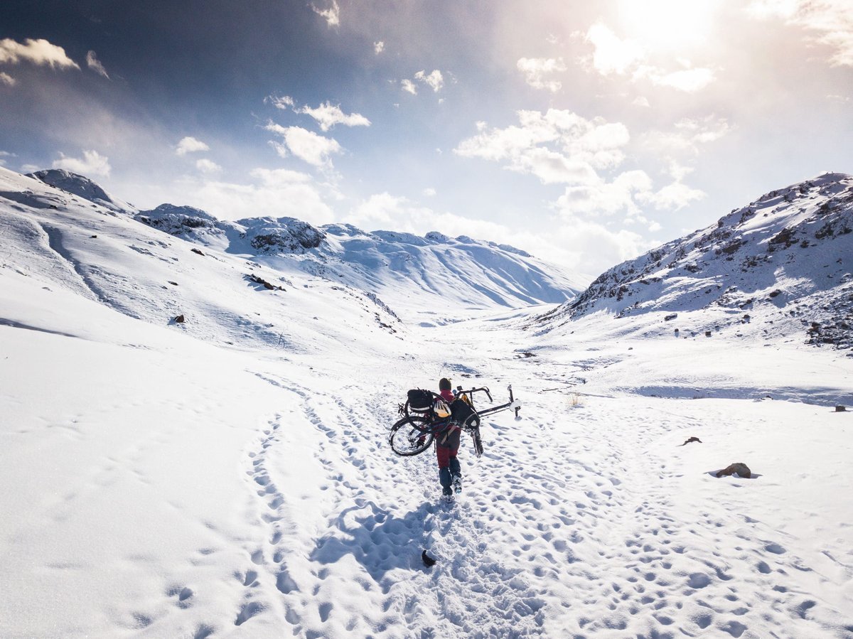 A man riding skis down a snow covered slope