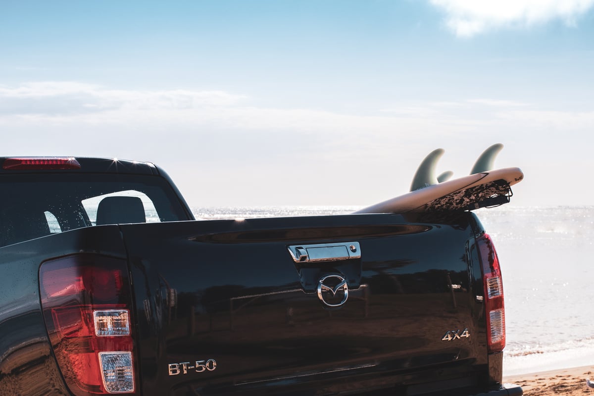 A car parked on the side of a truck