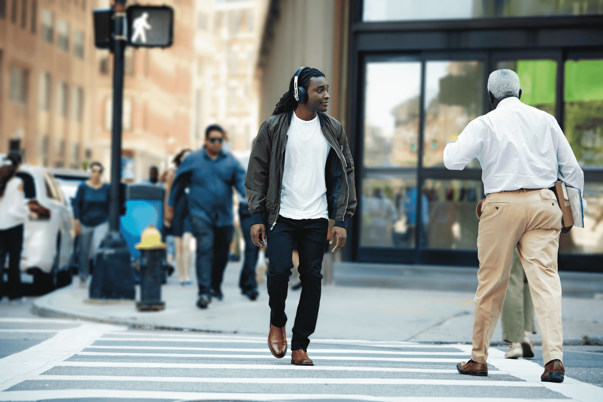 A group of people walking down the street