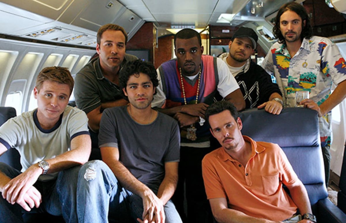 A group of people sitting posing for the camera