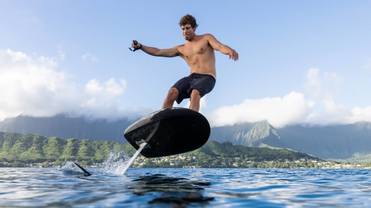 A man riding a wave on a surfboard in the water