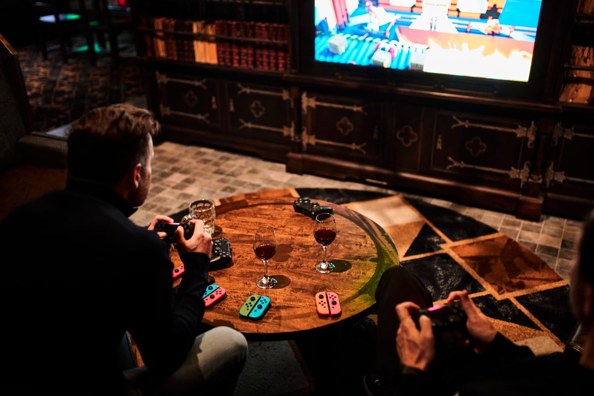 A flat screen tv sitting in front of a television playing a video game