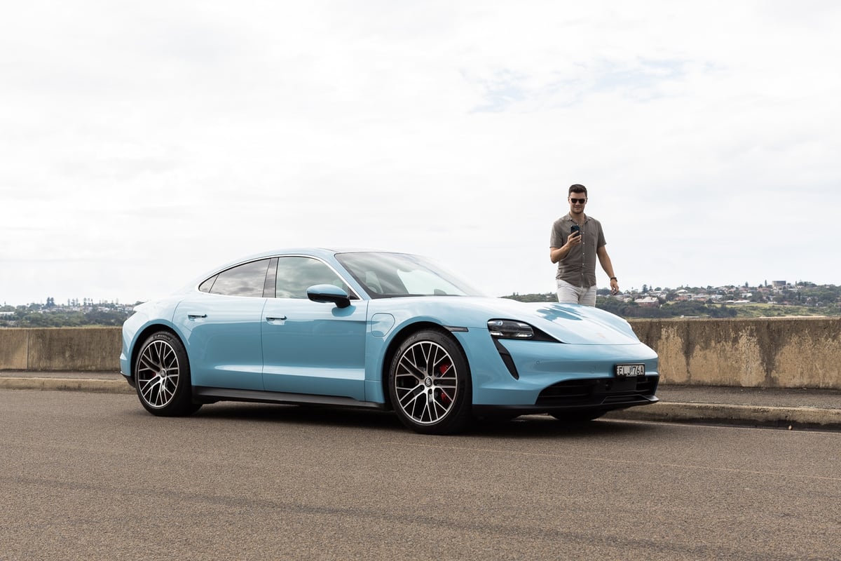 A man standing next to a car