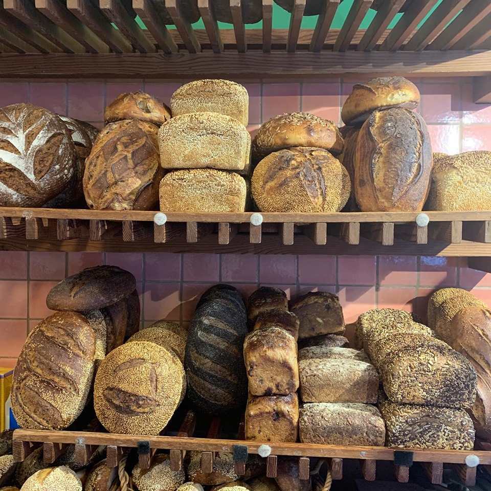 Stacks of freshly baked bread at Loafer Bread.