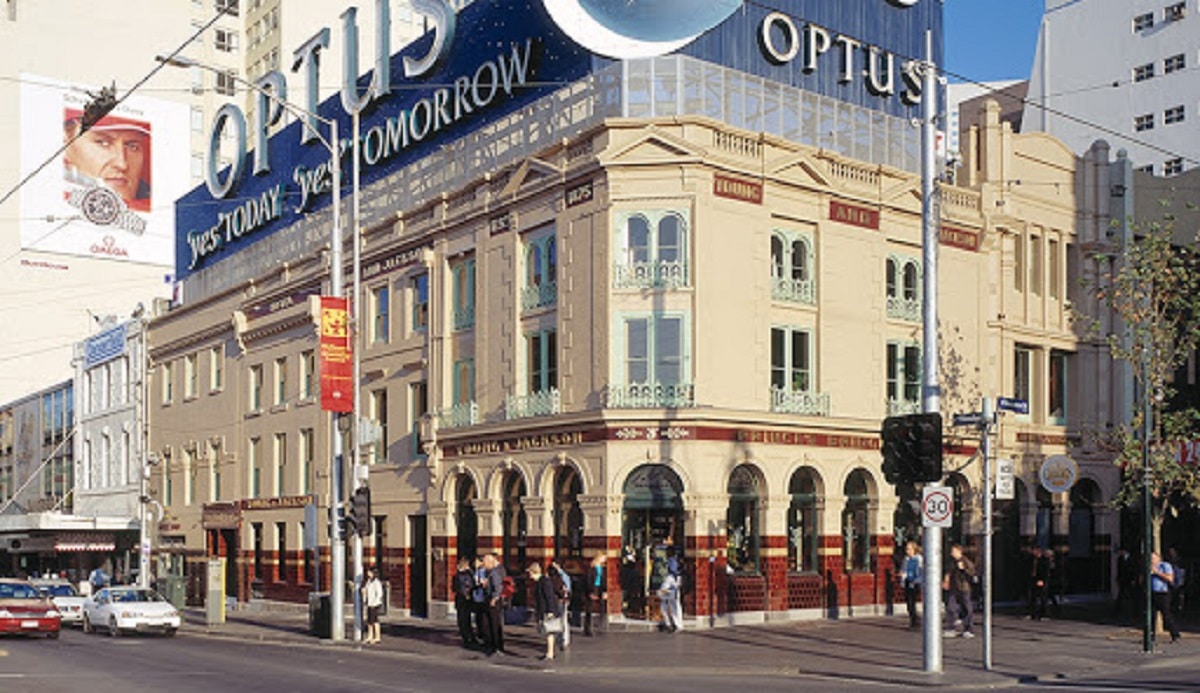 A close up of a busy city street in front of a building