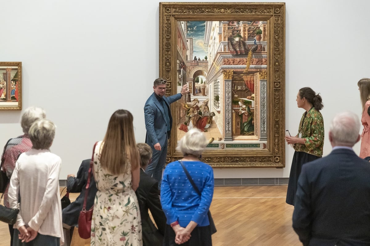 A group of people standing in a room