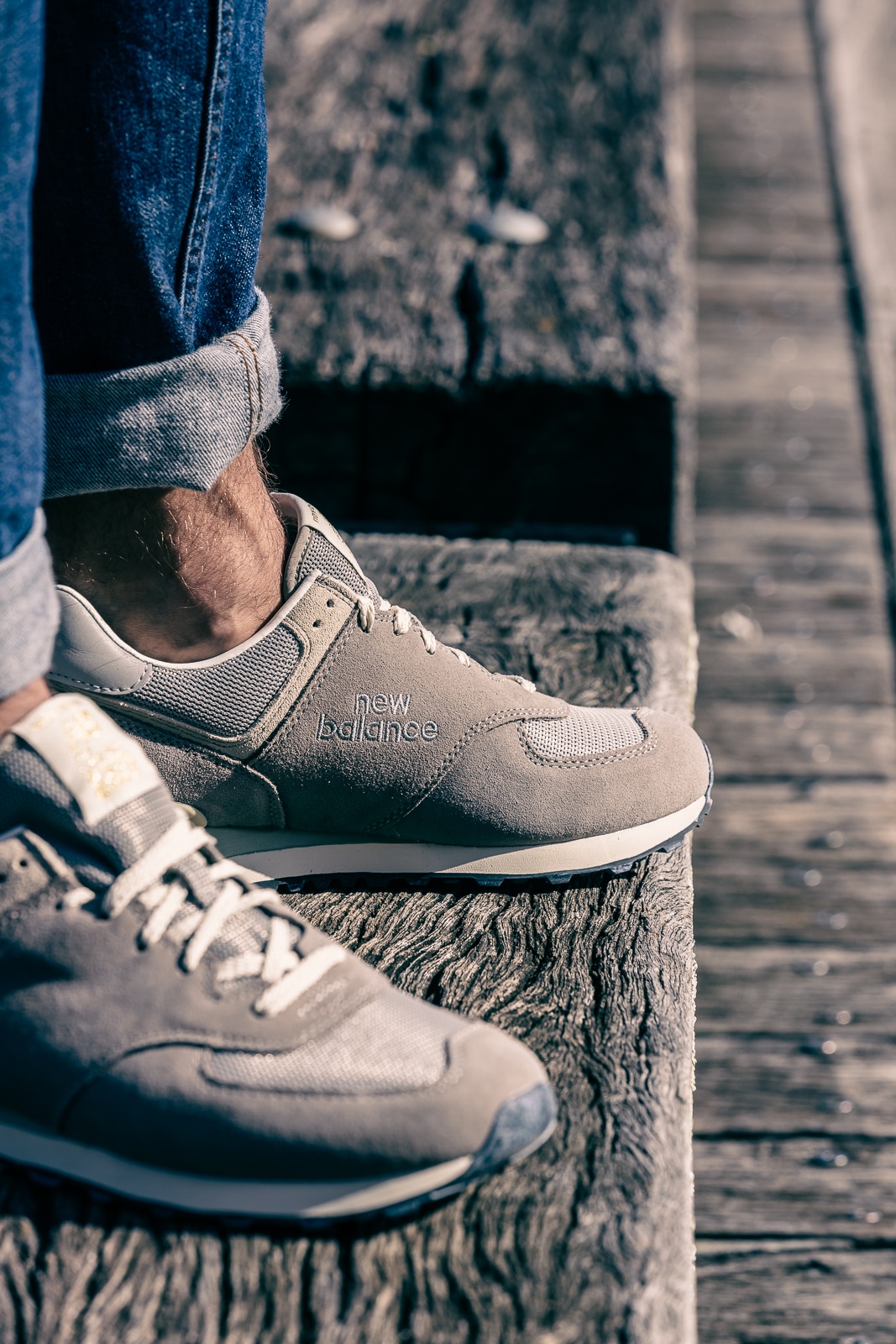 A close up of feet wearing blue shoes