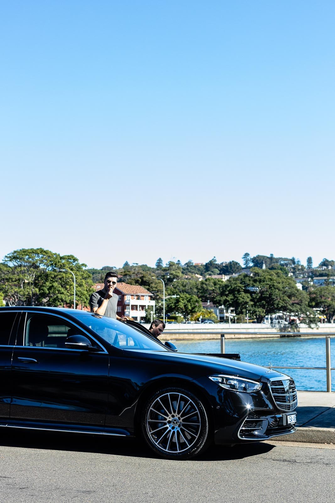 A car parked next to a body of water