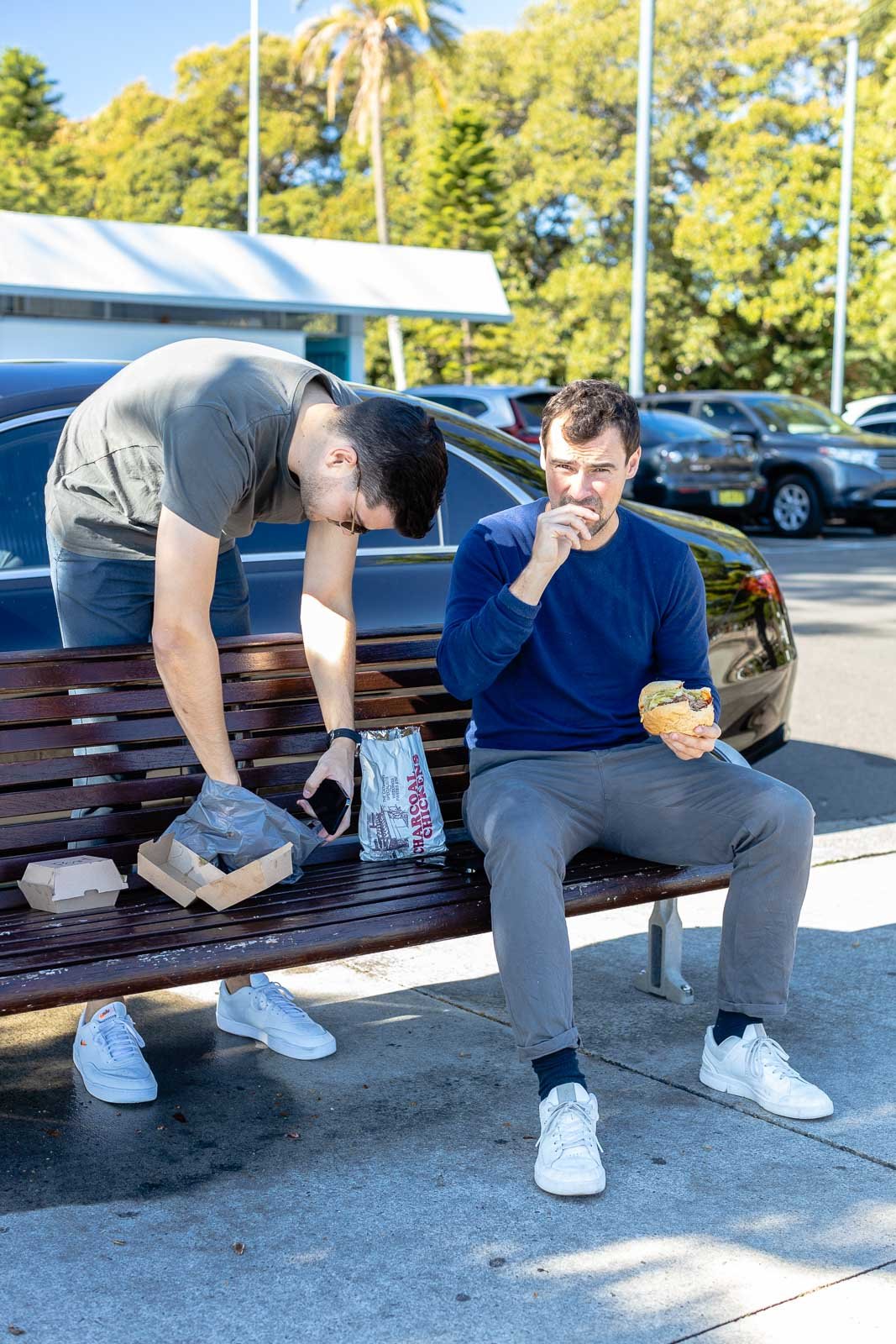 A man and a woman sitting on a bench