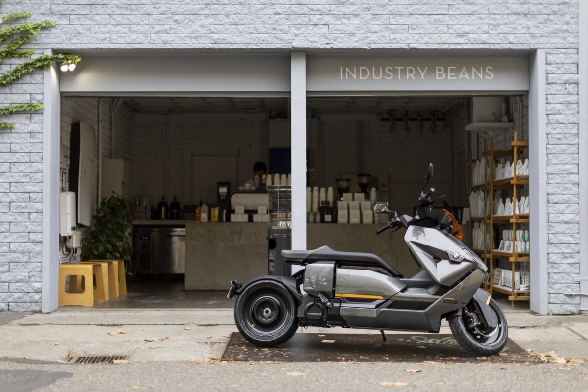 A scooter parked in front of a house