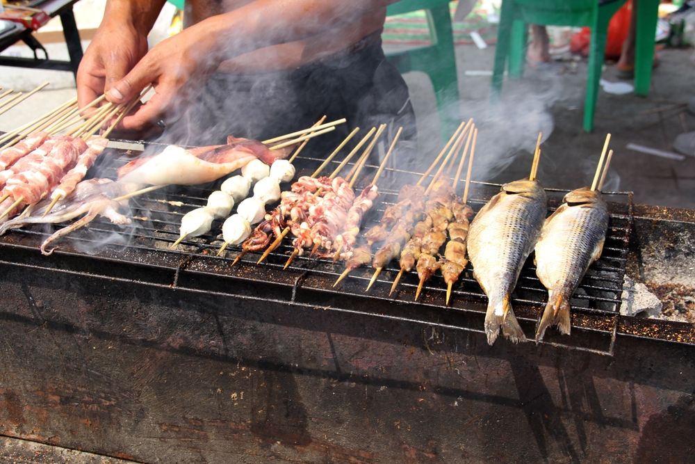 Cooking over charcoal with a hibachi grill