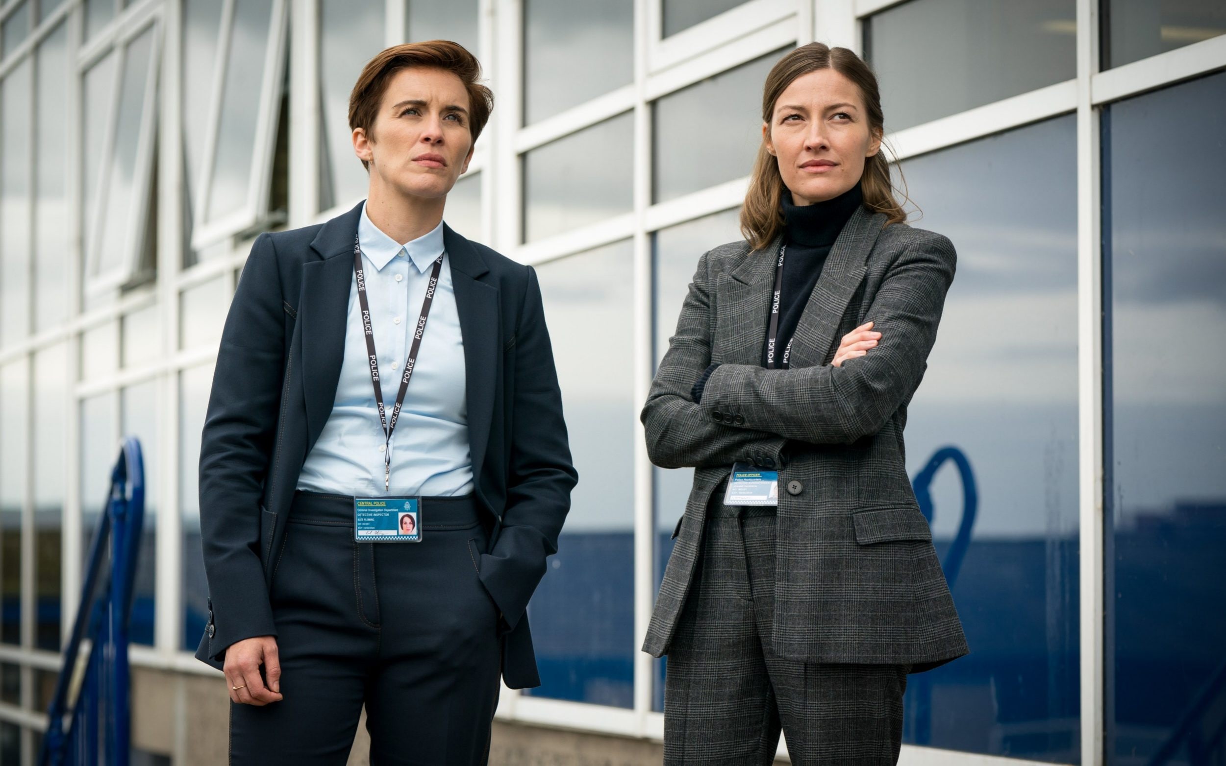 Vicky McClure, Kelly Macdonald standing in front of a building