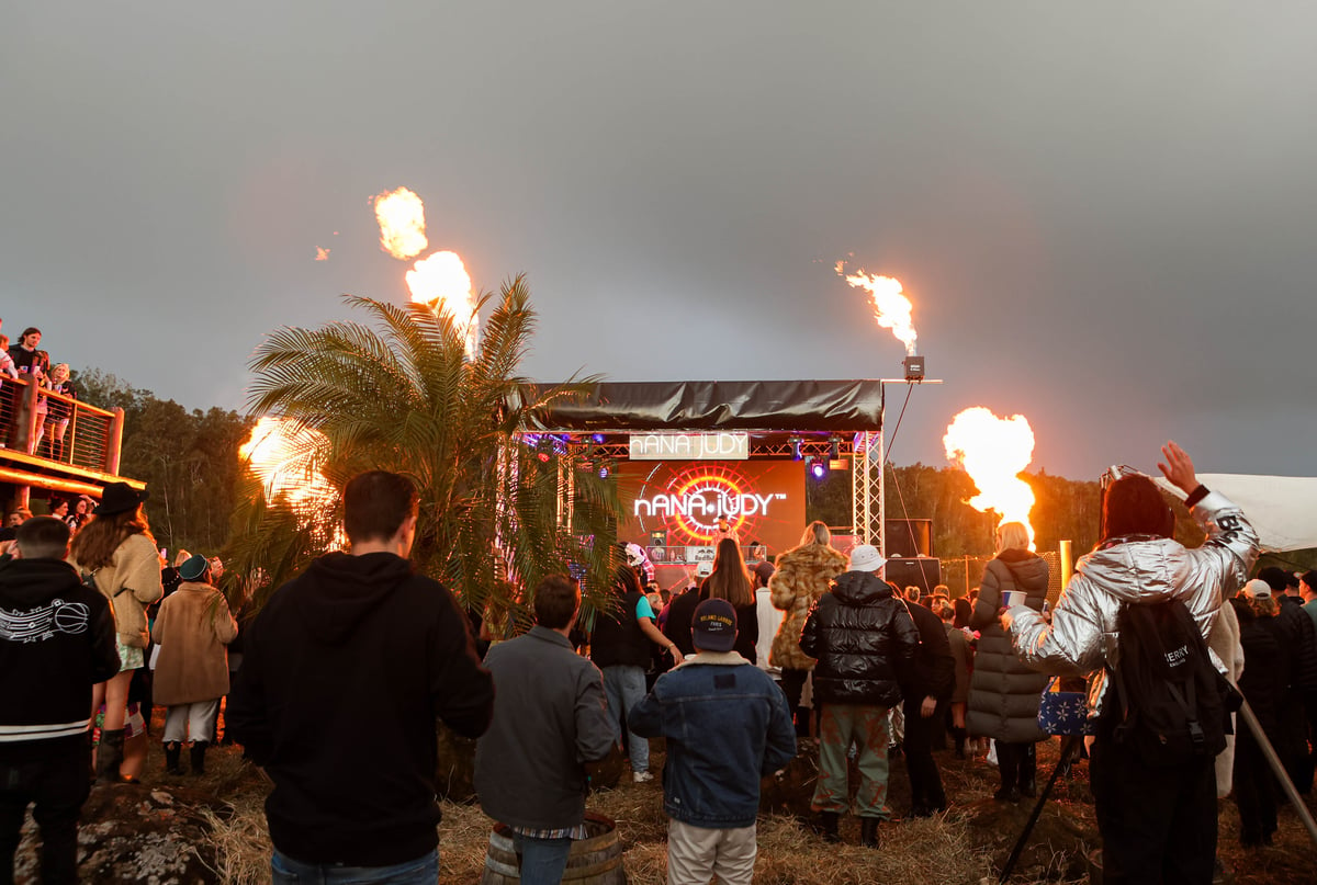 A group of people standing around a fire