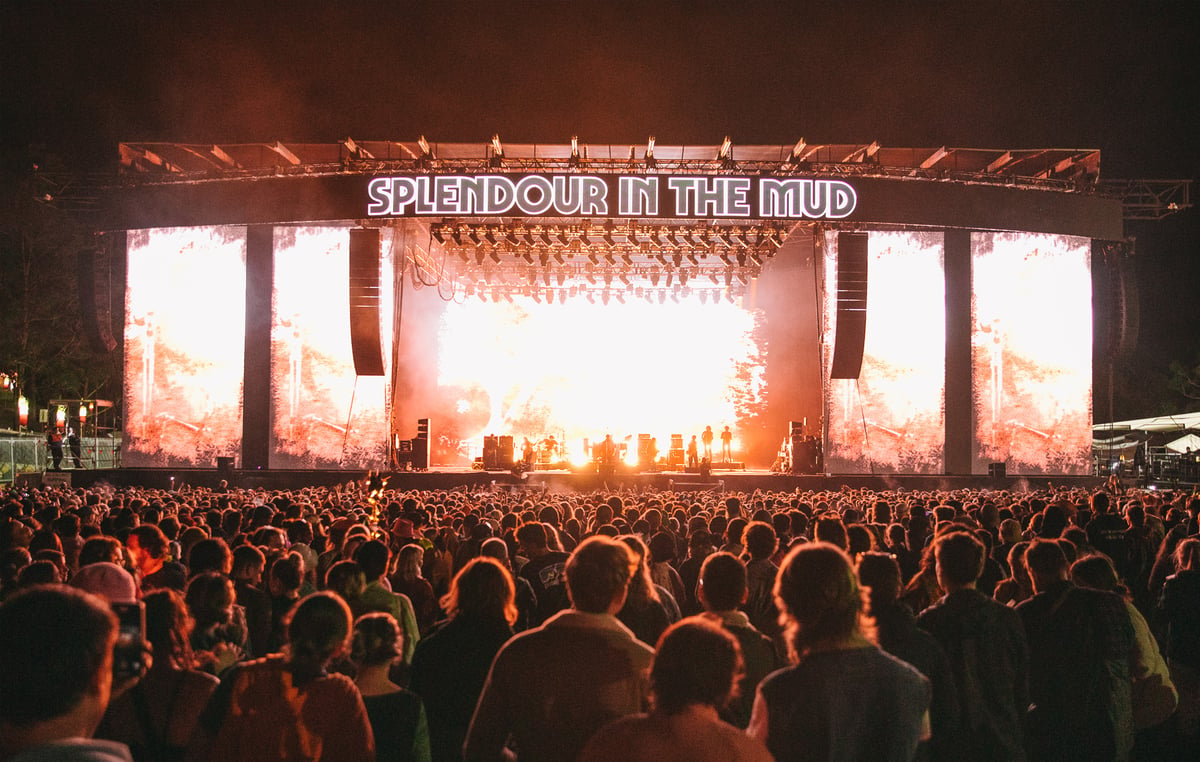 A group of people standing in front of a crowd