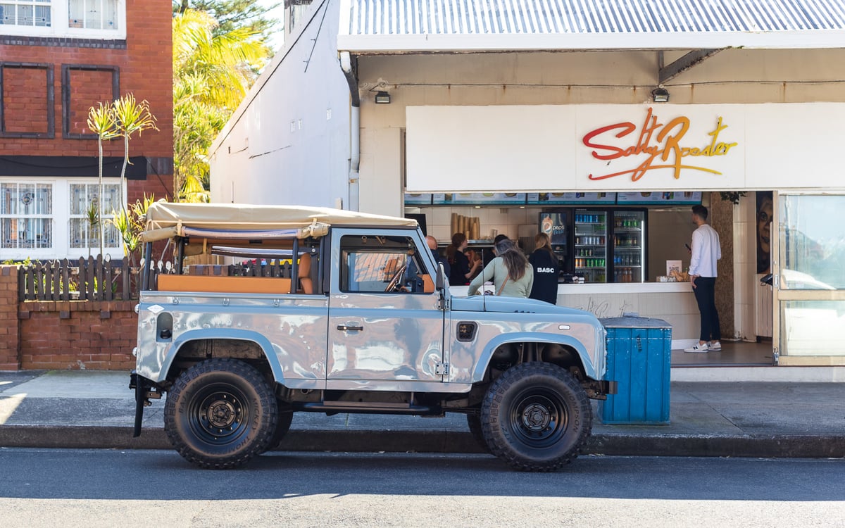 A truck is parked in front of a house