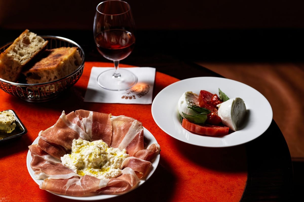 A table topped with plates of food on a plate