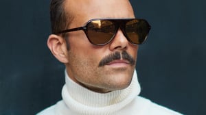 A close up of a man wearing sunglasses