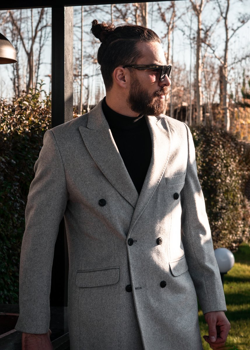 A man wearing a suit and tie