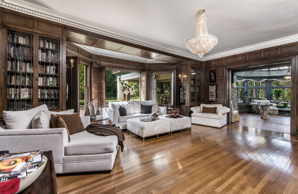 A living room filled with furniture and a fire place