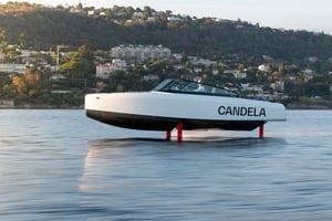The Candela C-8 flys above the water.