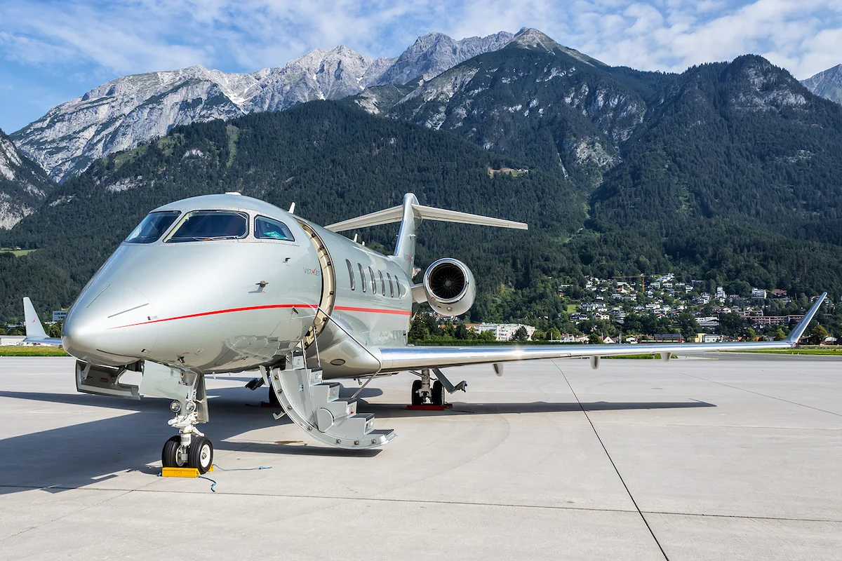 A large passenger jet sitting on top of a mountain