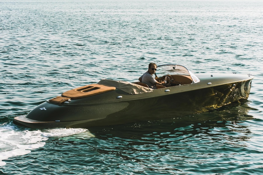 A person lying on a boat in the water