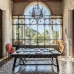 A living room filled with furniture and a large window