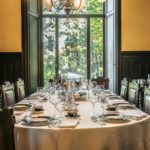A dining room table in front of a window