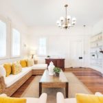 A living room filled with furniture and a fire place