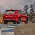 A car driving down a dirt road