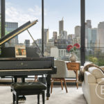 A piano next to a window