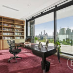 A living room filled with furniture and a large window