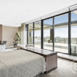 A hotel room with a large window