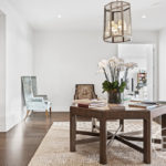A living room filled with furniture and vase on a table