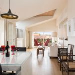 A kitchen with a dining room table