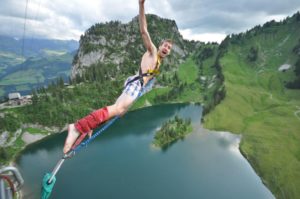 A person riding on top of a mountain