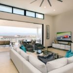 A living room filled with furniture and a large window