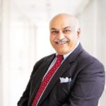 A person wearing a suit and tie