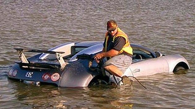 A man in a boat on a body of water