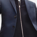 A man wearing a suit and tie